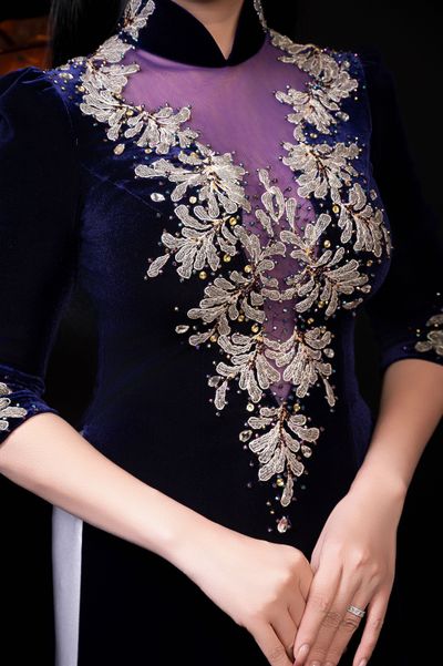 Embroidered detail on a velvet evening gown
